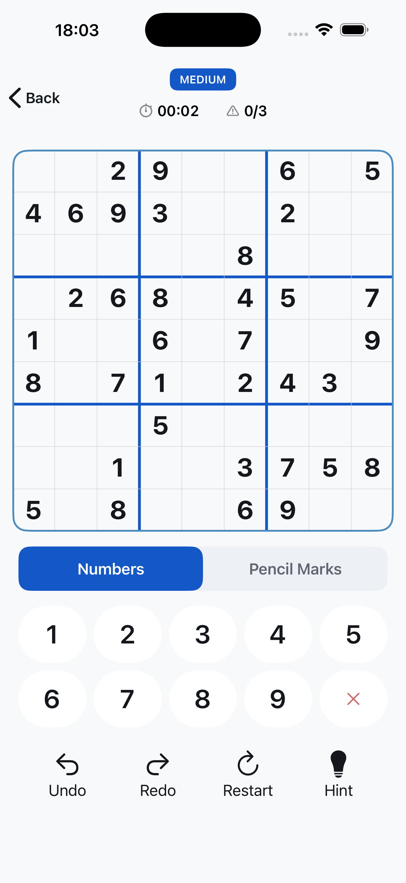 iSudoku classic 9x9 sudoku board showing clean grid styling, pencil Candidates notes, and active cell highlight.